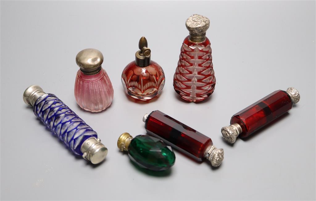 A Victorian double-ended blue glass lattice scent bottle, two double-ended ruby glass bottles and four other scent bottles